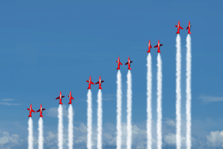 Six pairs of red fighter jets all climbing vertically, increasing in height from left to right
