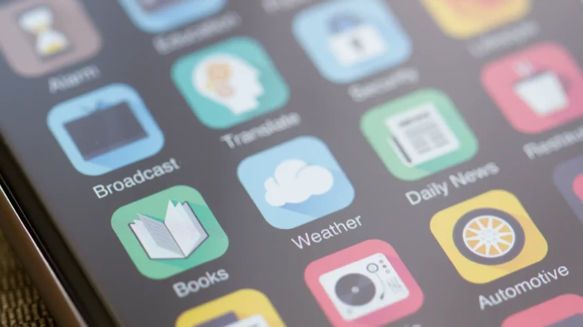 The homepage of an iPhone, showing generic apps such as Weather, Books, and News