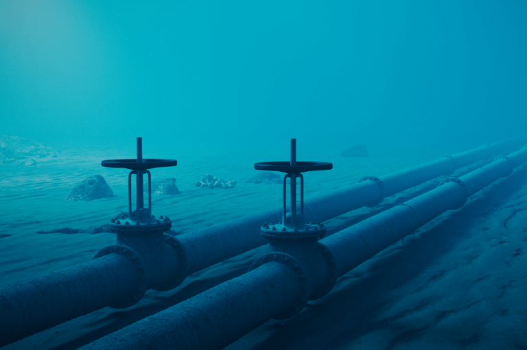 pipes sitting underwater deep at the bottom of the ocean
