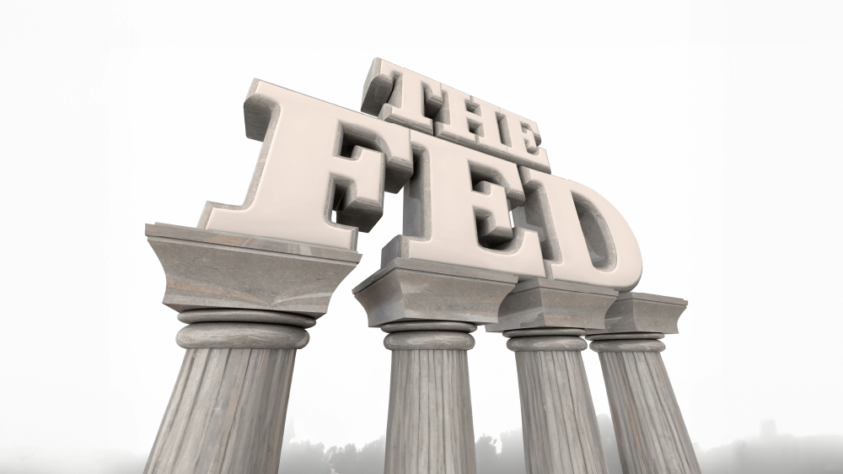 "The Fed" in large letters sitting atop four marble pillars