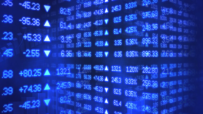 Layers of financial numbers and trends, in blue writing on a dark blue background