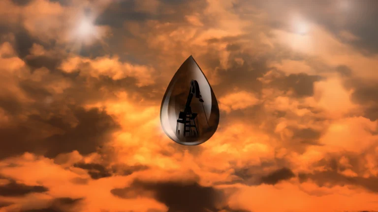 A drop of oil in front of a crimson sky